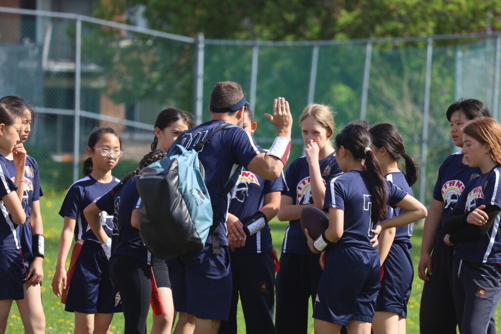 Kids listening to their coach